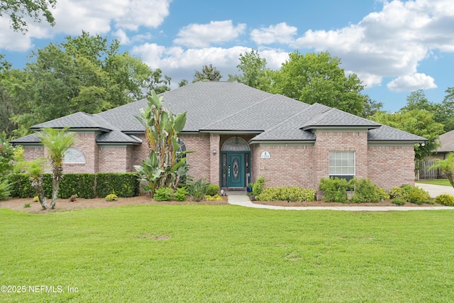 1288 Creek Bend Rd, Saint Johns, FL 32259 - view of front of home featuring a shingled roof, brick siding, and a front yard