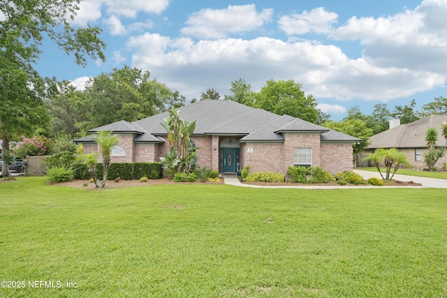 1288 Creek Bend Rd, Saint Johns, FL 32259 - view of front of property featuring a front lawn, roof with shingles, and brick siding