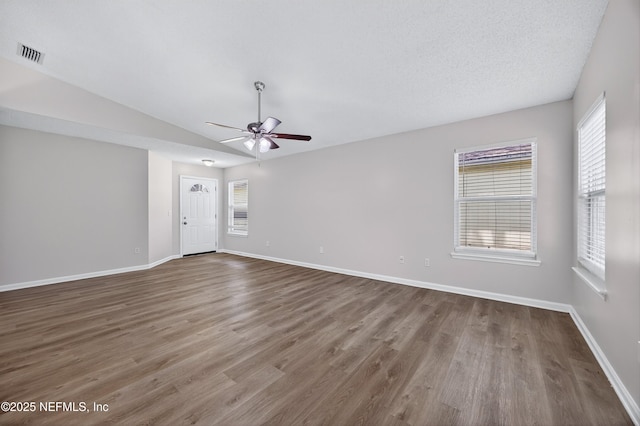 1359 Cove Landing Dr, Jacksonville, FL 32233 - unfurnished room with a ceiling fan, healthy amount of natural light, wood finished floors, and vaulted ceiling