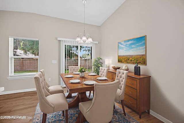 1359 Cove Landing Dr, Jacksonville, FL 32233 - dining space with a chandelier, wood finished floors, healthy amount of natural light, and high vaulted ceiling