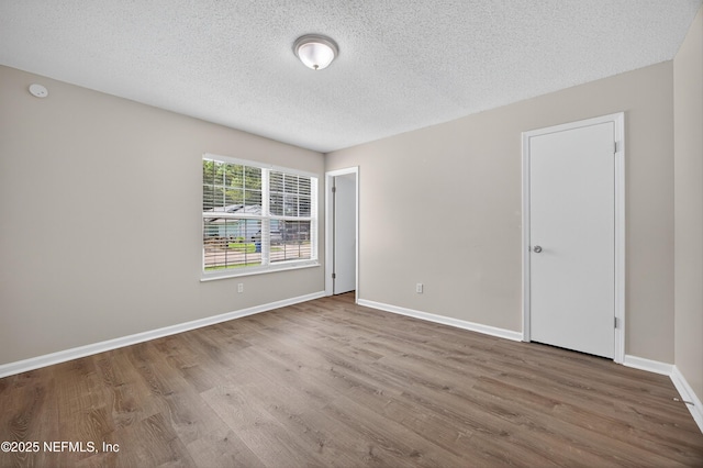 1359 Cove Landing Dr, Jacksonville, FL 32233 - spare room with wood finished floors and a textured ceiling
