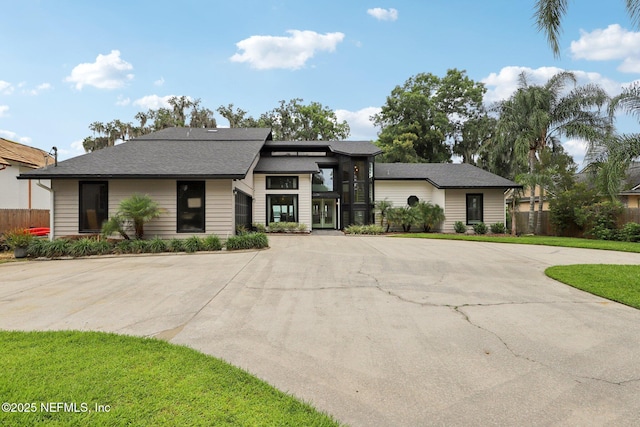 1823 N Lakeshore Dr, Fleming Island, FL 32003 - view of front of property featuring curved driveway and french doors