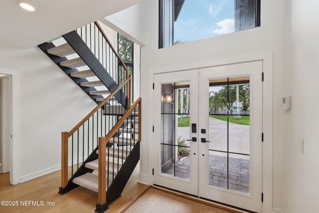 1823 N Lakeshore Dr, Fleming Island, FL 32003 - foyer entrance with french doors, wood finished floors, stairs, and a towering ceiling