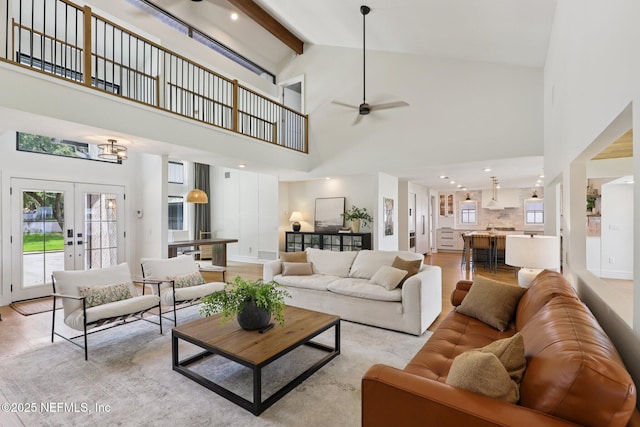 1823 N Lakeshore Dr, Fleming Island, FL 32003 - living room featuring high vaulted ceiling, a ceiling fan, beamed ceiling, light wood finished floors, and french doors