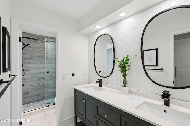 1823 N Lakeshore Dr, Fleming Island, FL 32003 - bathroom featuring double vanity, a stall shower, recessed lighting, and tile patterned floors