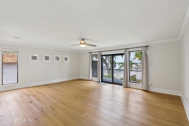 1823 N Lakeshore Dr, Fleming Island, FL 32003 - unfurnished room with a ceiling fan, plenty of natural light, ornamental molding, and light wood finished floors
