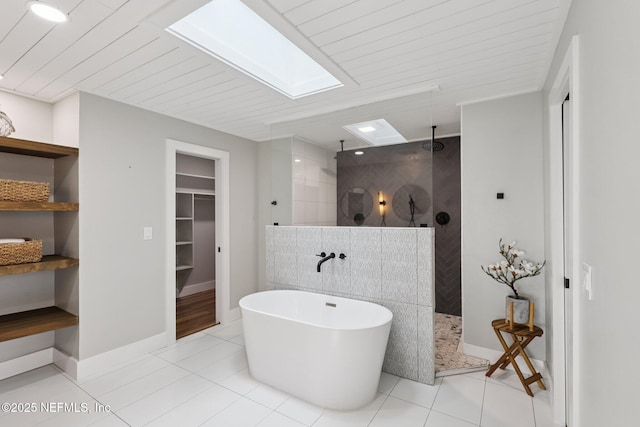1823 N Lakeshore Dr, Fleming Island, FL 32003 - bathroom featuring a skylight, walk in shower, a walk in closet, and a freestanding bath