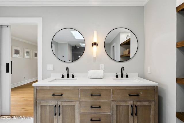 1823 N Lakeshore Dr, Fleming Island, FL 32003 - bathroom featuring ornamental molding, double vanity, and wood finished floors
