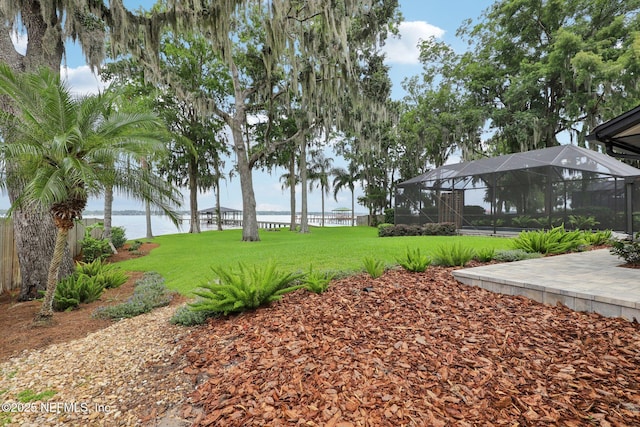 1823 N Lakeshore Dr, Fleming Island, FL 32003 - view of green lawn with a water view and a lanai