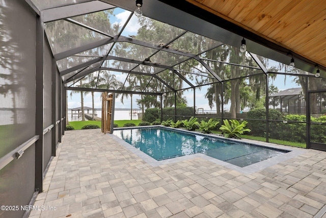 1823 N Lakeshore Dr, Fleming Island, FL 32003 - outdoor pool featuring a patio area and glass enclosure