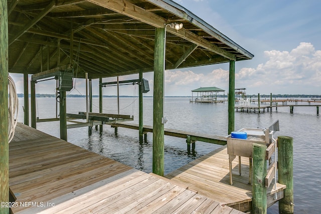 1823 N Lakeshore Dr, Fleming Island, FL 32003 - dock area featuring boat lift and a water view