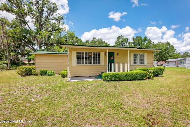 37206 Cypress Ln, Hilliard, FL 32046 - view of front of home featuring a front lawn and covered porch