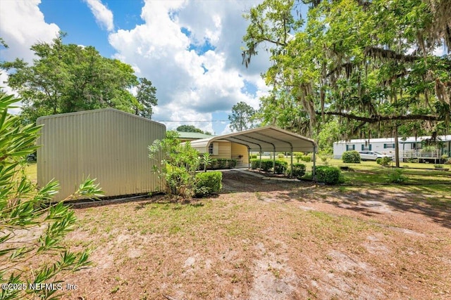 37206 Cypress Ln, Hilliard, FL 32046 - view of yard with a detached carport and dirt driveway