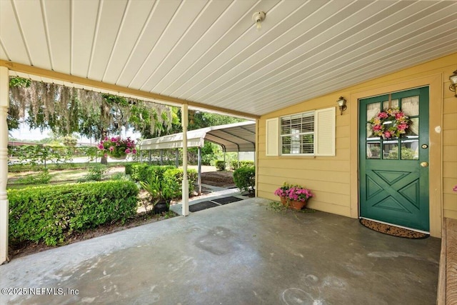 37206 Cypress Ln, Hilliard, FL 32046 - view of patio / terrace featuring a carport