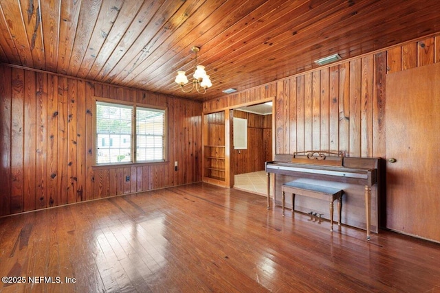 37206 Cypress Ln, Hilliard, FL 32046 - interior space with a chandelier, wooden ceiling, wood-type flooring, and wooden walls
