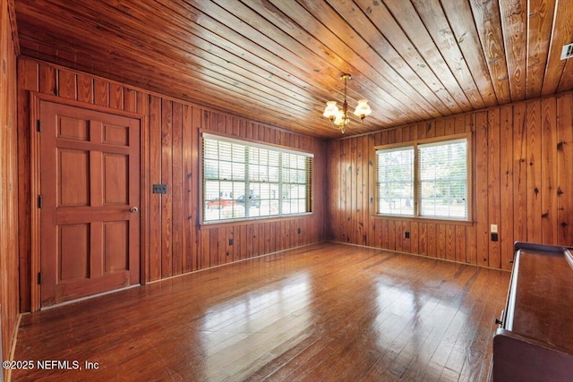 37206 Cypress Ln, Hilliard, FL 32046 - foyer featuring wooden ceiling, a chandelier, hardwood / wood-style flooring, and wooden walls