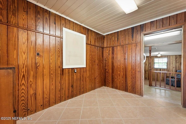 37206 Cypress Ln, Hilliard, FL 32046 - unfurnished room featuring wood walls and tile patterned floors