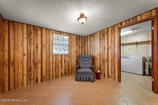 37206 Cypress Ln, Hilliard, FL 32046 - unfurnished room featuring a textured ceiling, wood walls, and tile patterned flooring