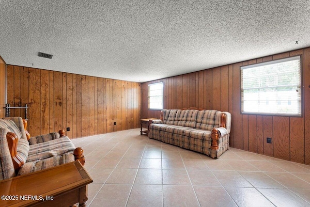 37206 Cypress Ln, Hilliard, FL 32046 - tiled living area with wooden walls and a textured ceiling