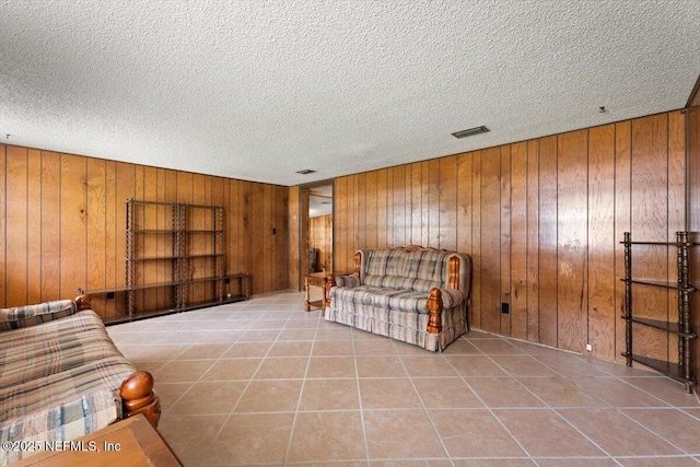 37206 Cypress Ln, Hilliard, FL 32046 - tiled living area with wooden walls and a textured ceiling