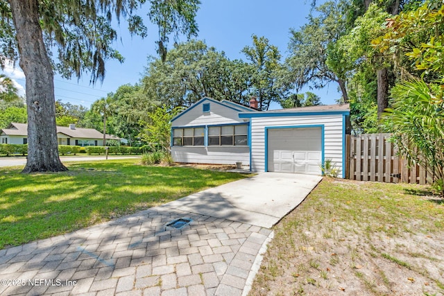 112 S 14th St, Fernandina Beach, FL 32034 - view of front of property with a garage and concrete driveway
