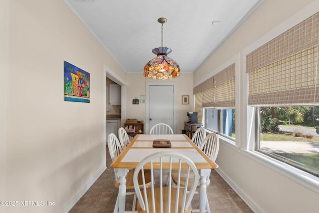 112 S 14th St, Fernandina Beach, FL 32034 - dining room with baseboards and tile patterned flooring