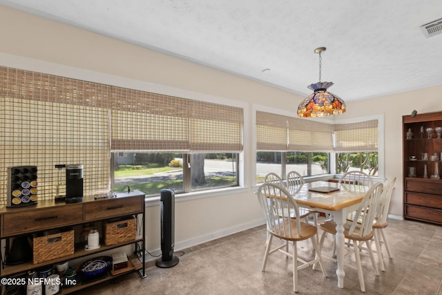 112 S 14th St, Fernandina Beach, FL 32034 - dining room with baseboards and a textured ceiling