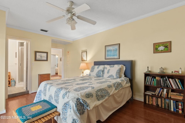 112 S 14th St, Fernandina Beach, FL 32034 - bedroom featuring wood finished floors, crown molding, ensuite bath, and a ceiling fan