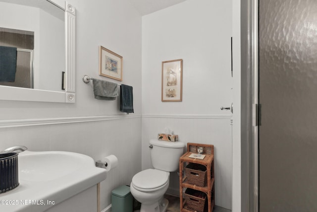 112 S 14th St, Fernandina Beach, FL 32034 - full bathroom featuring a stall shower, wainscoting, and vanity