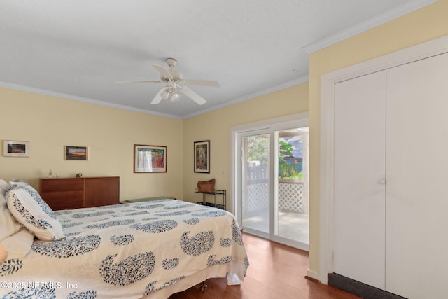112 S 14th St, Fernandina Beach, FL 32034 - bedroom with access to outside, ornamental molding, wood finished floors, and ceiling fan