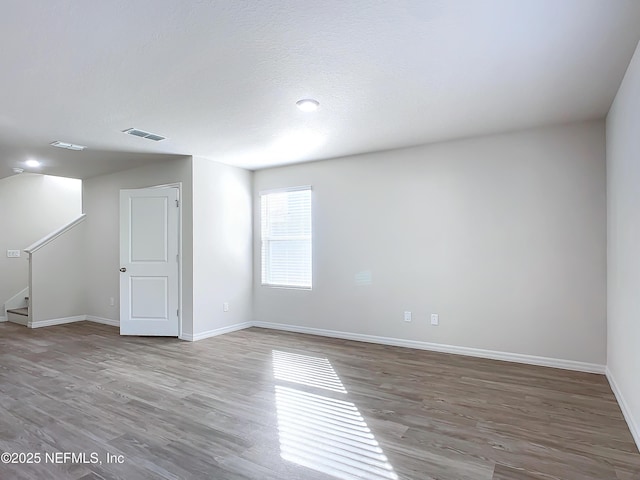 29 Wood Ash Ln, Palm Coast, FL 32164 - unfurnished room with wood finished floors and stairway
