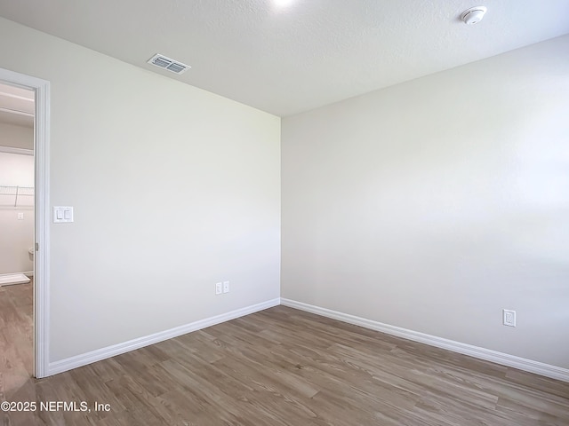 29 Wood Ash Ln, Palm Coast, FL 32164 - unfurnished room with wood finished floors and a smoke detector