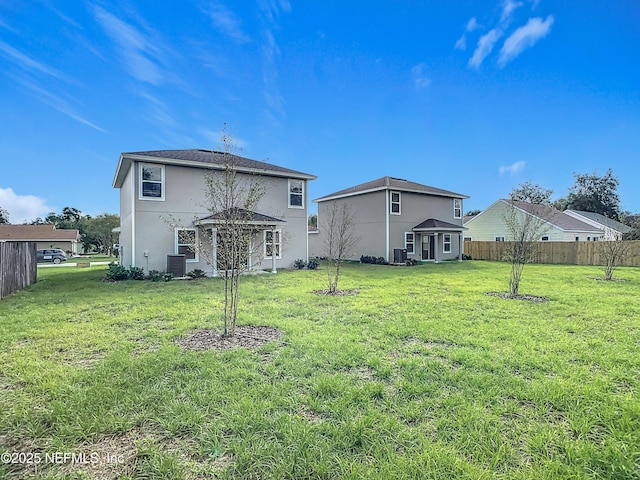 29 Wood Ash Ln, Palm Coast, FL 32164 - back of house featuring stucco siding