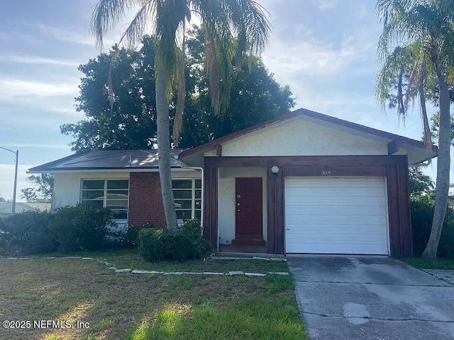 819 Helmsman Way, Palm Harbor, FL 34685 - single story home with concrete driveway, an attached garage, and stucco siding