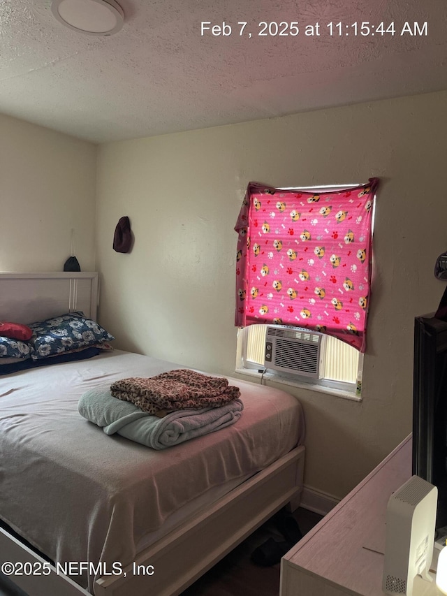 1417 Logan St Unit 1417-1419, Jacksonville, FL 32209 - bedroom with a textured ceiling and cooling unit
