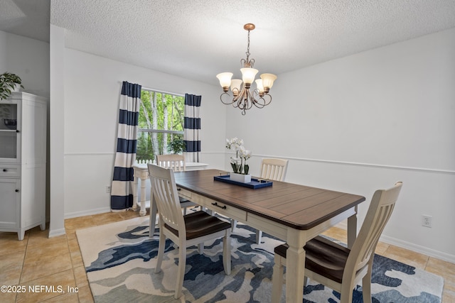 1853 Weston Cir, Fleming Island, FL 32003 - dining space with a chandelier, light tile patterned floors, and a textured ceiling