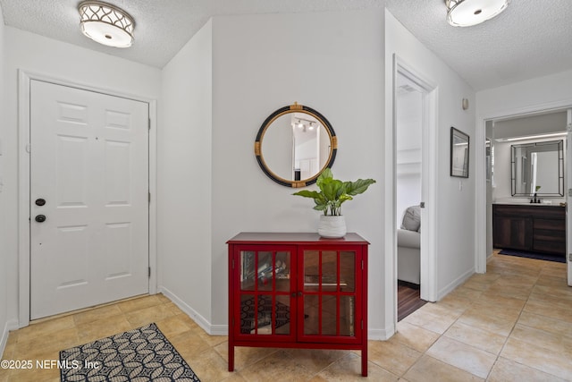 1853 Weston Cir, Fleming Island, FL 32003 - foyer featuring a textured ceiling and light tile patterned floors