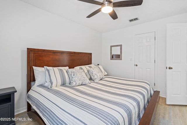 1853 Weston Cir, Fleming Island, FL 32003 - bedroom with light wood finished floors and ceiling fan