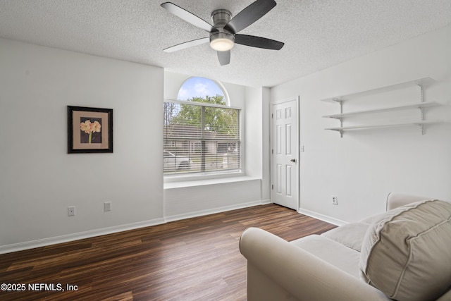 1853 Weston Cir, Fleming Island, FL 32003 - living room featuring a textured ceiling, wood finished floors, and ceiling fan