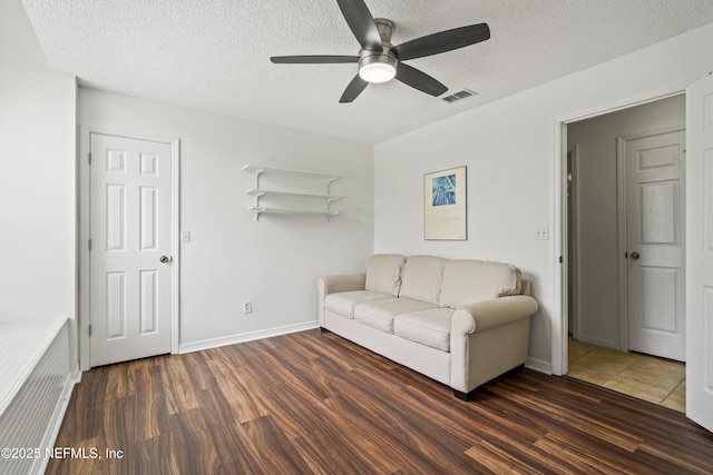 1853 Weston Cir, Fleming Island, FL 32003 - living room with a textured ceiling, ceiling fan, and wood finished floors