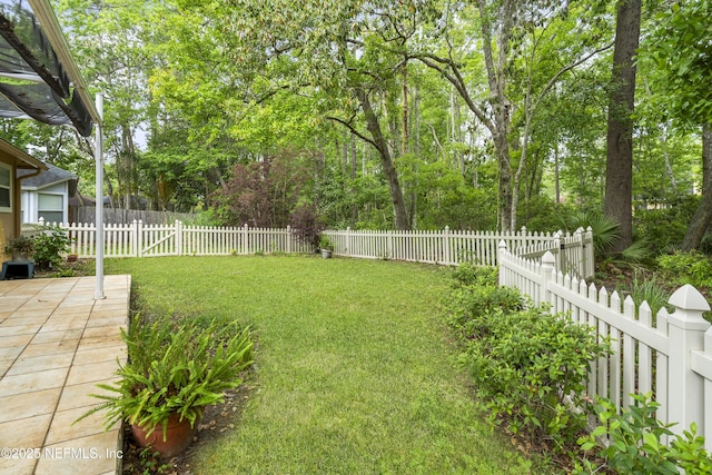 1853 Weston Cir, Fleming Island, FL 32003 - fenced backyard with a patio