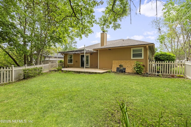 1853 Weston Cir, Fleming Island, FL 32003 - rear view of property featuring a patio area, a chimney, and a fenced backyard