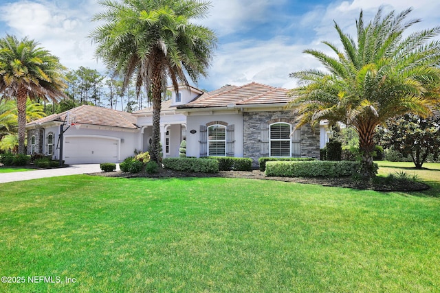 452 Deer Valley Dr, Ponte Vedra, FL 32081 - mediterranean / spanish-style house with an attached garage, a front yard, a tiled roof, stucco siding, and driveway