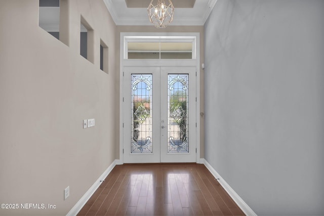 452 Deer Valley Dr, Ponte Vedra, FL 32081 - foyer entrance featuring french doors, a chandelier, crown molding, and dark wood-style floors