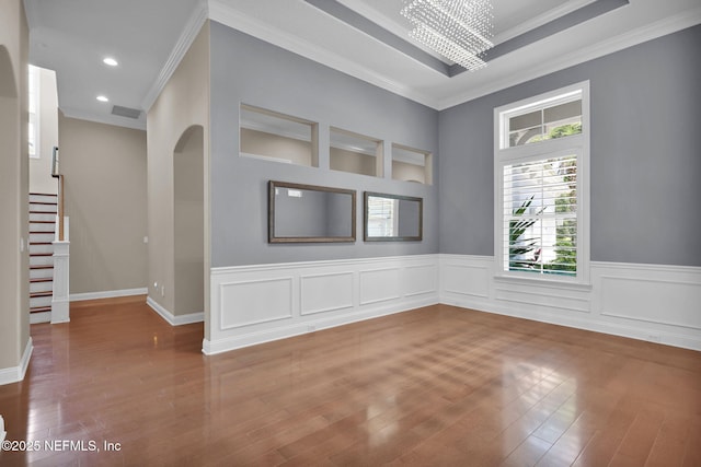 452 Deer Valley Dr, Ponte Vedra, FL 32081 - unfurnished room featuring wood finished floors, stairs, ornamental molding, a chandelier, and a wainscoted wall
