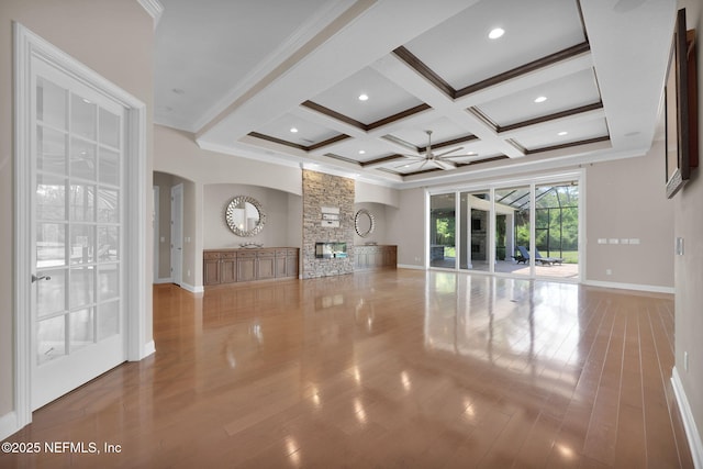 452 Deer Valley Dr, Ponte Vedra, FL 32081 - unfurnished living room with coffered ceiling, a ceiling fan, beam ceiling, arched walkways, and crown molding