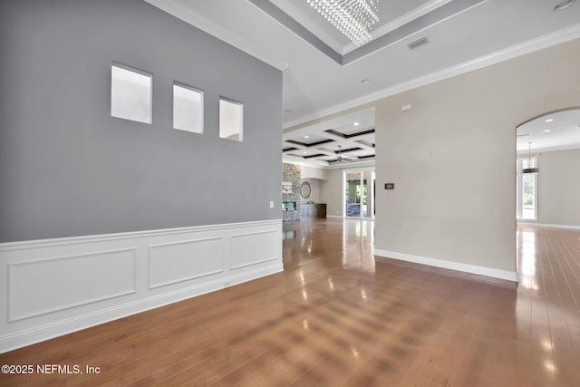452 Deer Valley Dr, Ponte Vedra, FL 32081 - corridor featuring coffered ceiling, arched walkways, ornamental molding, wood finished floors, and beamed ceiling