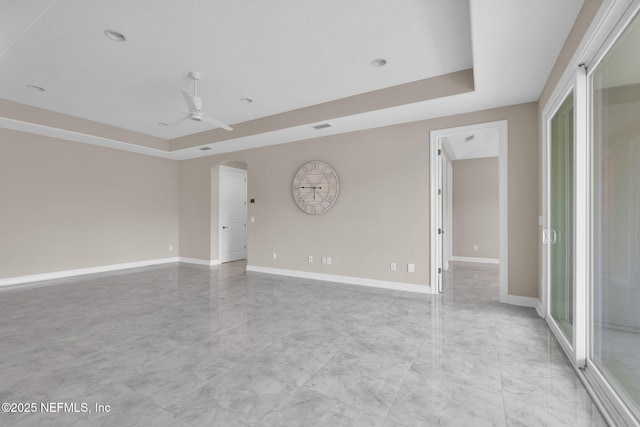 452 Deer Valley Dr, Ponte Vedra, FL 32081 - empty room featuring ceiling fan, a tray ceiling, arched walkways, and recessed lighting