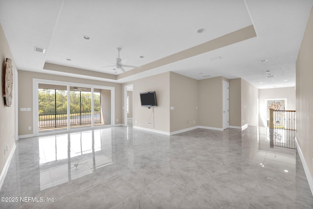 452 Deer Valley Dr, Ponte Vedra, FL 32081 - unfurnished living room with ceiling fan, a chandelier, and a tray ceiling