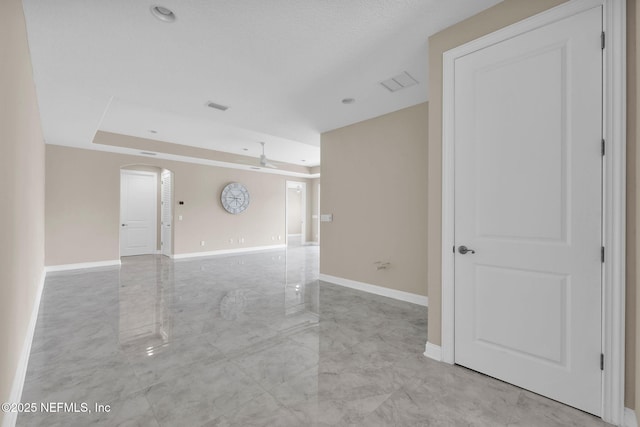 452 Deer Valley Dr, Ponte Vedra, FL 32081 - spare room with arched walkways, a tray ceiling, and ceiling fan